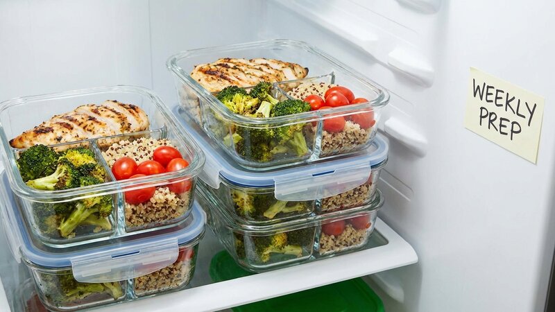 Organized meal prep containers with portioned protein and vegetables